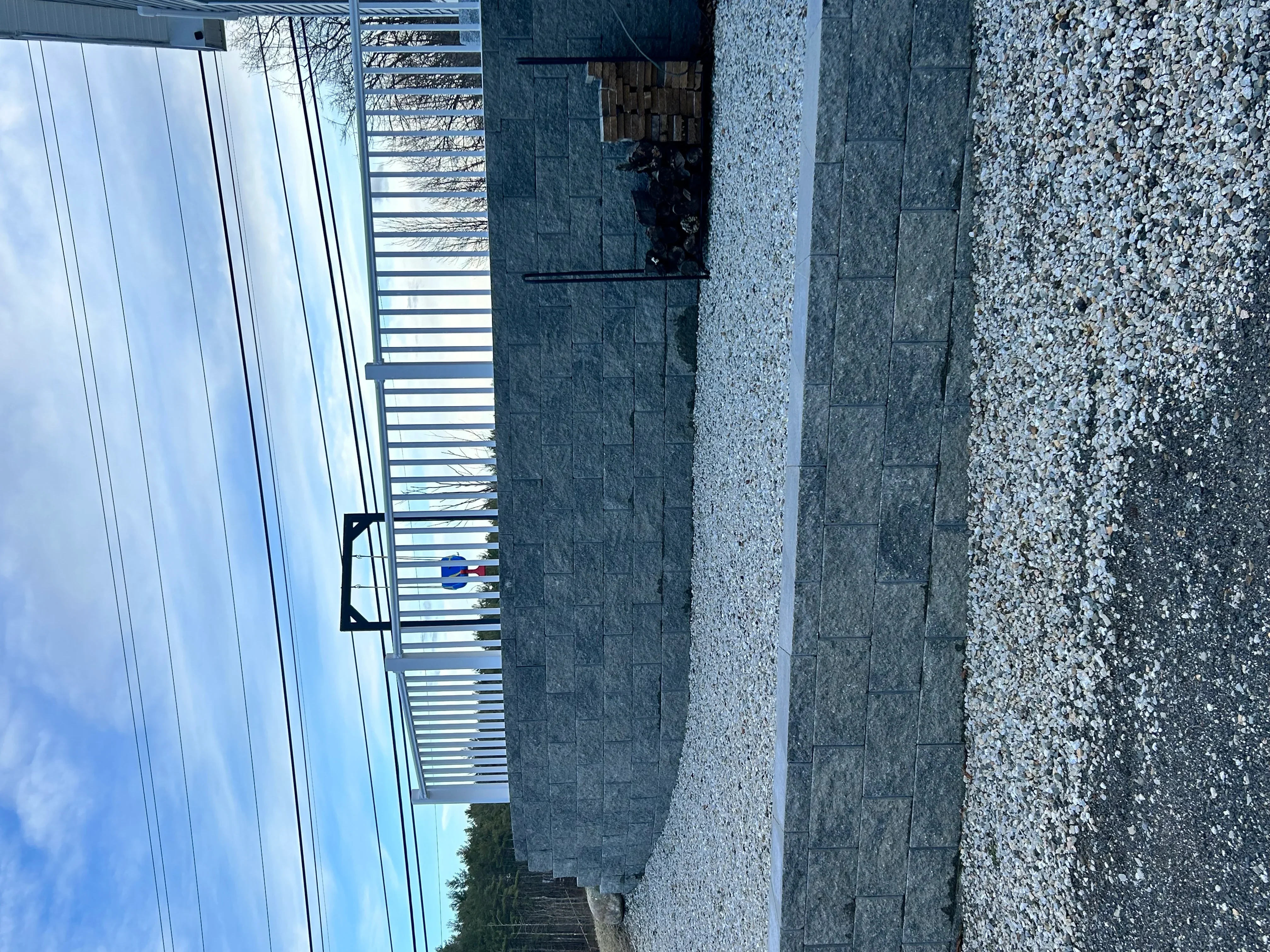 Crushed gravel driveway with metal culvert and landscape edging installation